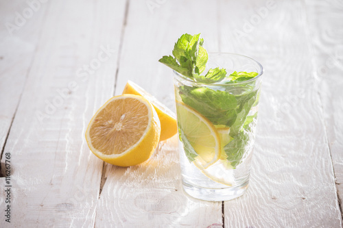 Soft drink with lemon, ice and mint