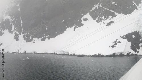 Cruise ship entering Lemaire Channel, Antarctic Peninslula, Antarctica photo