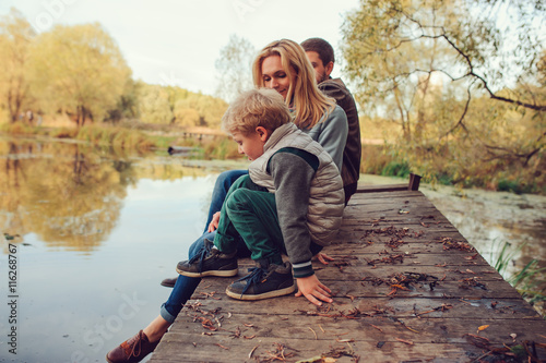 happy family spending time together outdoor. Lifestyle capture, rural cozy scene.