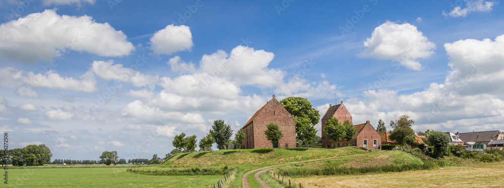 Panorama of medieval church of the Groningen village Ezinge - obrazy, fototapety, plakaty 