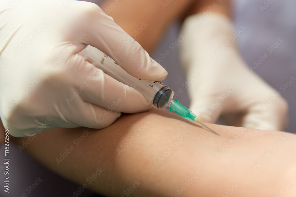 Needle and syringe in an elbow Needle and syringe in an elbow