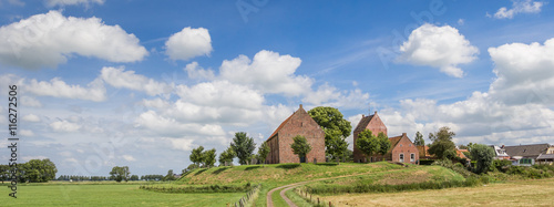 Panorama of medieval church of the Groningen village Ezinge photo