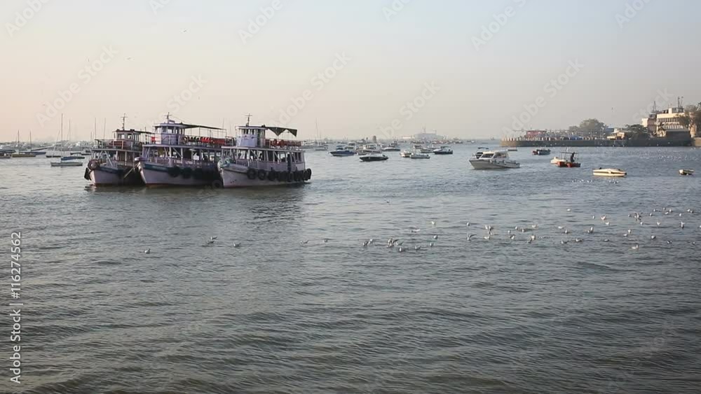 Tourist and fisher boats by the harbour Tourist and fisher boats by the harbour