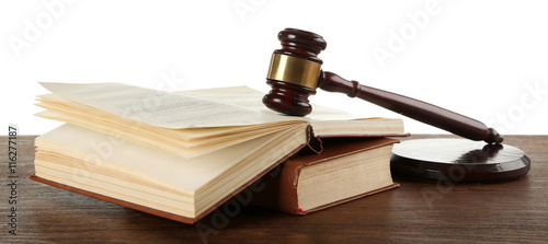 Photography Gavel and books on wooden table on white background