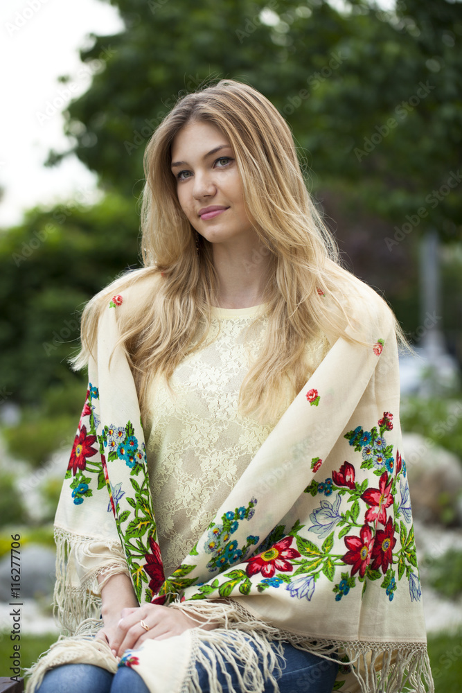 Russian woman in the national patterned scarf Russian woman in the national patterned scarf