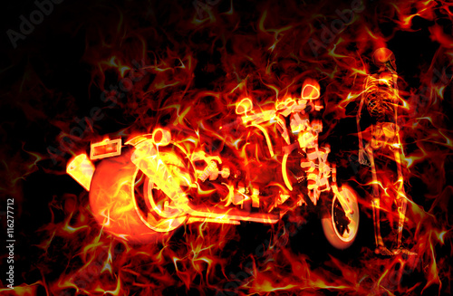 Fiery burning motorbike and skeleton with flames around them photo