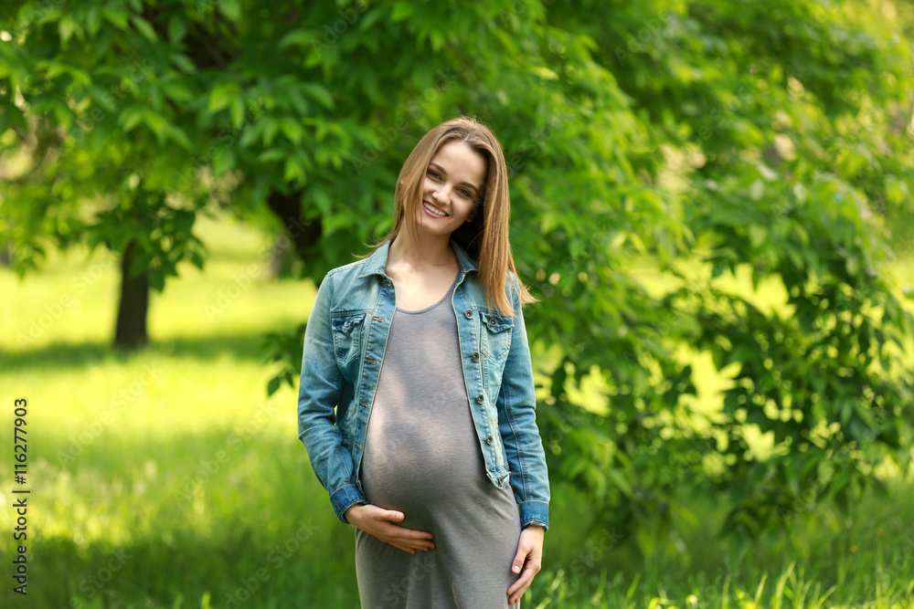 Beautiful pregnant woman in park Beautiful pregnant woman in park