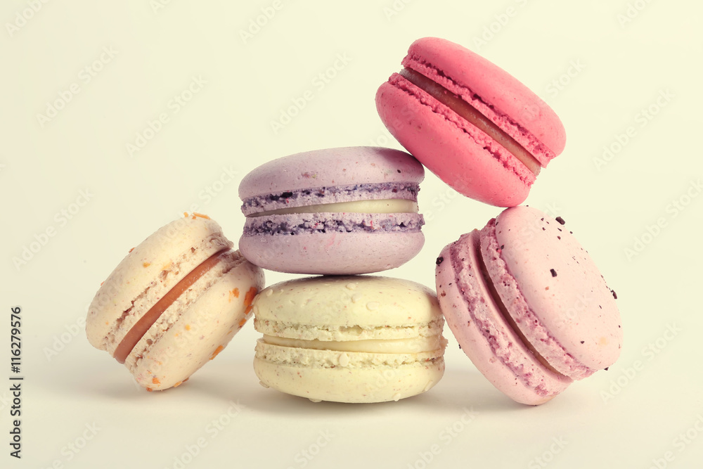 Heap of colorful tasty macaroons on white background Heap of colorful tasty macaroons on white background
