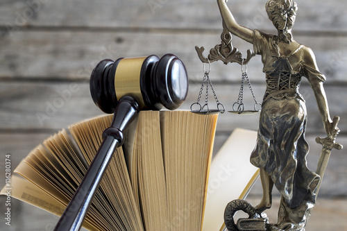 Law concept. Gavel, statue and book