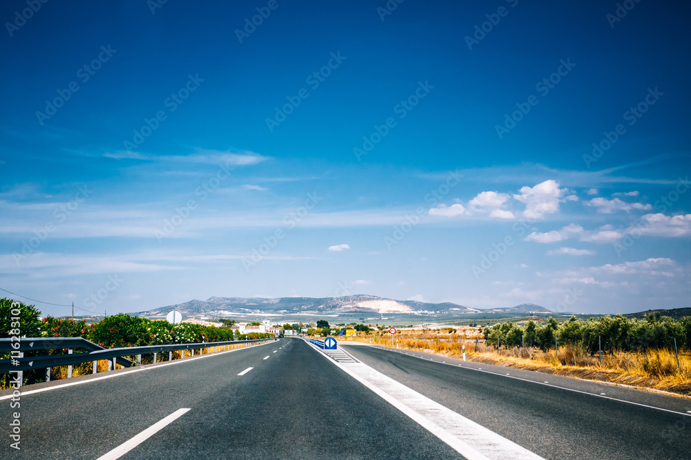 Fototapeta premium Beautiful empty asphalt freeway, motorway, highway in Andalusia,