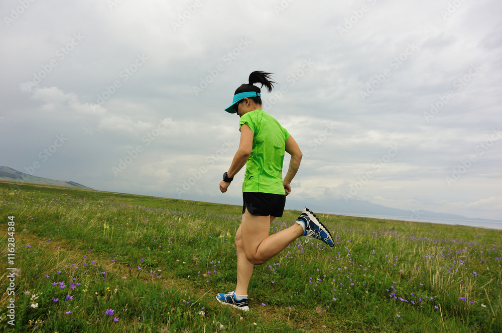 healthy young woman trail runner running on beautiful trail healthy young woman trail runner running on beautiful trail