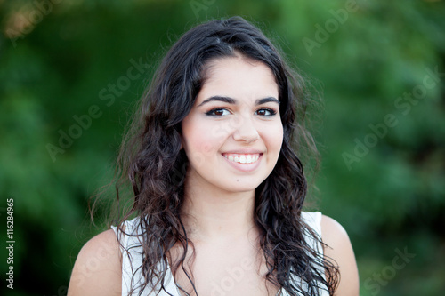 Beautiful brunette girl relaxing in the park