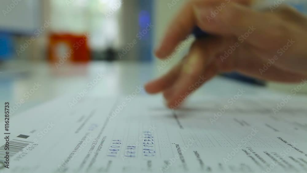 Zoom in Woman's Hand Neatly Complete a Form. Woman Writes With a Pen ...