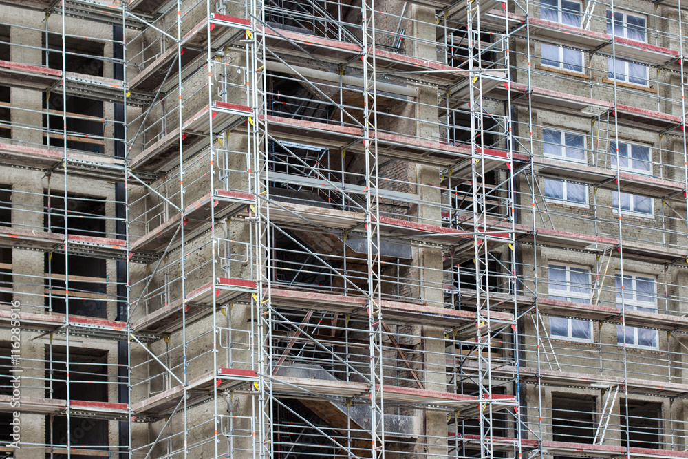 scaffold on building facade - construction site scaffold on building facade - construction site