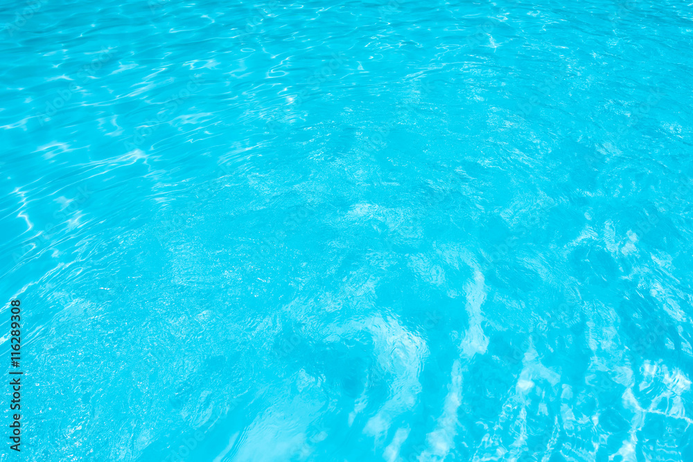 Ripple Blue Water in swimming pool witn sun reflection