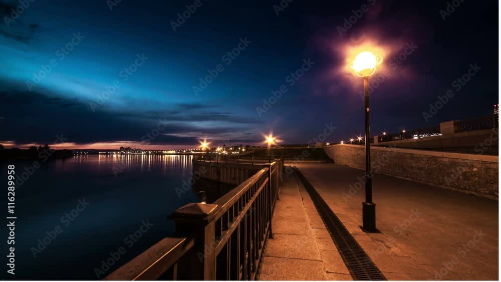 View of seafront in night city. Illumination. View of seafront in night city. Illumination.