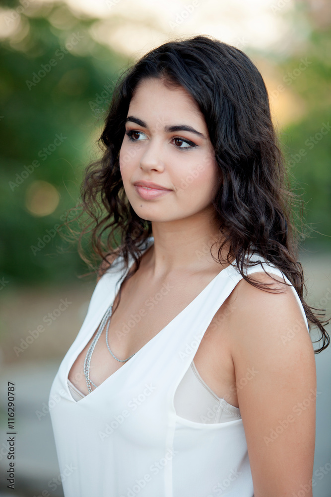 Beautiful brunette girl relaxing in the park Beautiful brunette girl relaxing in the park