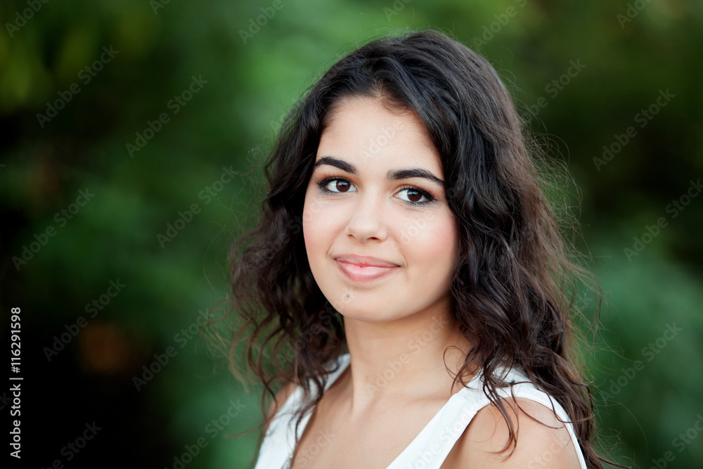 Beautiful brunette girl relaxing in the park Beautiful brunette girl relaxing in the park