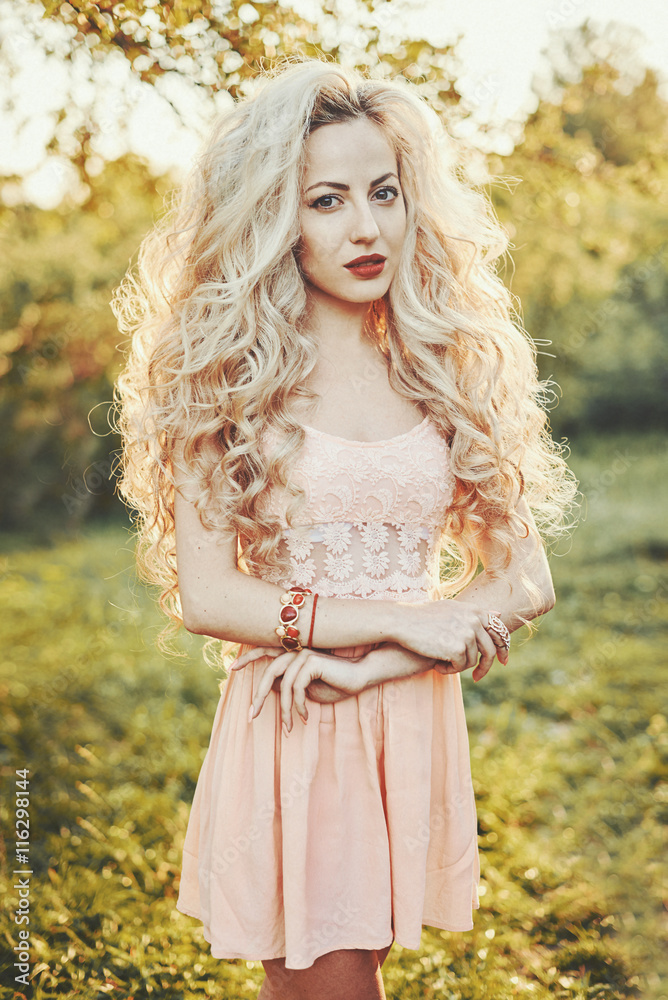 beautiful girl in the garden on a sunny day beautiful girl in the garden on a sunny day