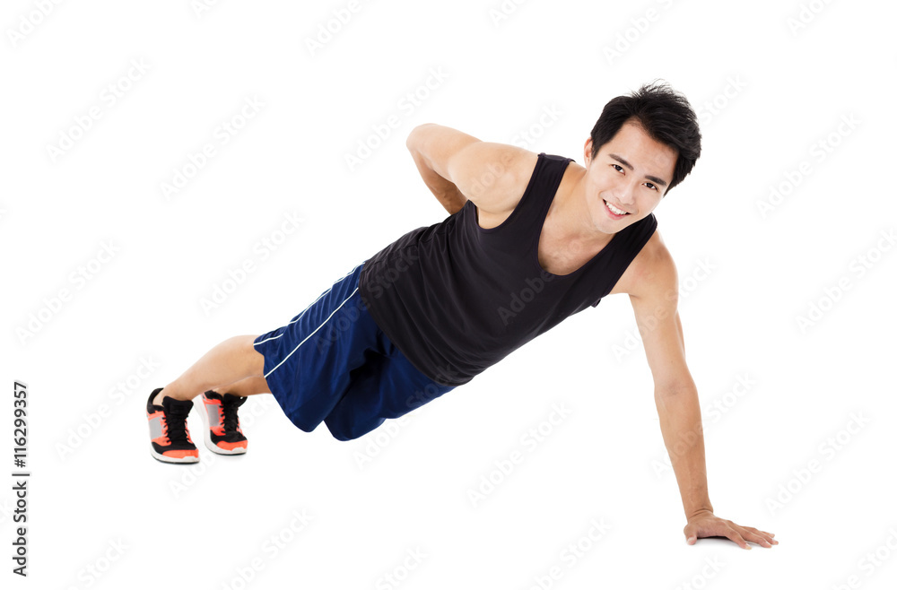 young handsome man doing push up exercise