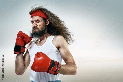 Funny boxer wearing red boxing gloves