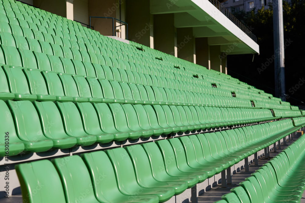 Fototapeta premium empty football stadium chairs