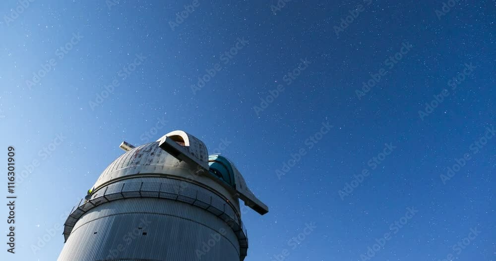 Rozhen astronomical observatory under the night sky stars. Blue sky