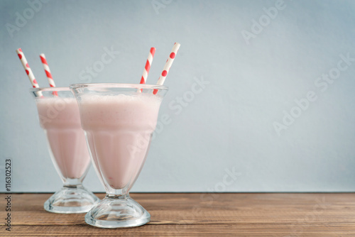 Milkshake on wodeen table photo