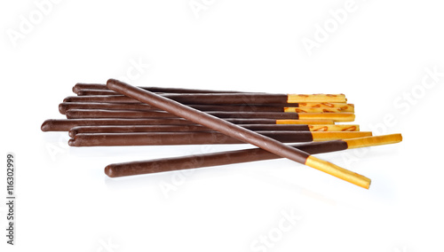 crackers stick and coated with black chocolate on white backgrou