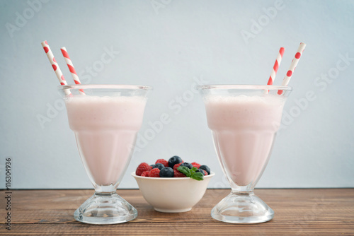 Milkshake on wodeen table photo