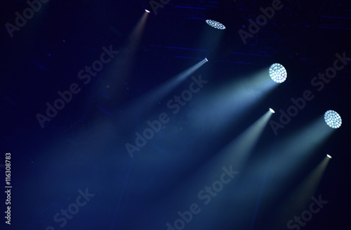 Blue stage lights, light show at concert photo