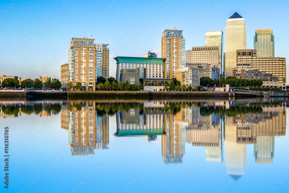 Canary Wharf, financial hub in London with reflection from River Thames