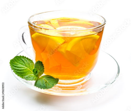 Transparent cup of lemon tea and mint