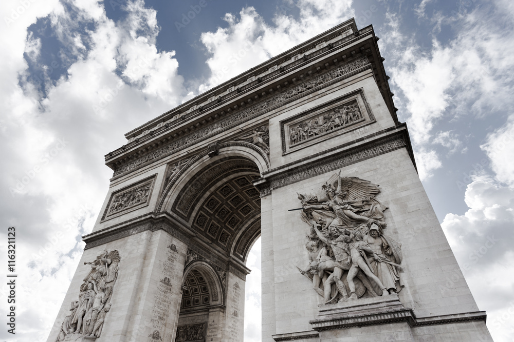 Triumphal arch. Paris. France. View of Place Charles de Gaulle. Famous touristic architecture landmark in summer day. Napoleon victory monument. Symbol of french glory. World historical heritage. Triumphal arch. Paris. France. View of Place Charles de Gaulle. Famous touristic architecture landmark in summer day. Napoleon victory monument. Symbol of french glory. World historical heritage.