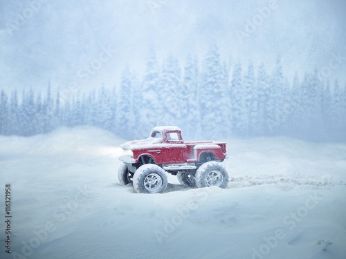 Miniature red monster truck in winter storm © goran_dj