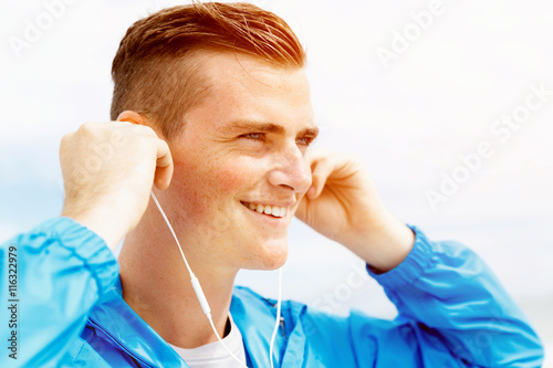 Sports and music. man getting ready for jogging