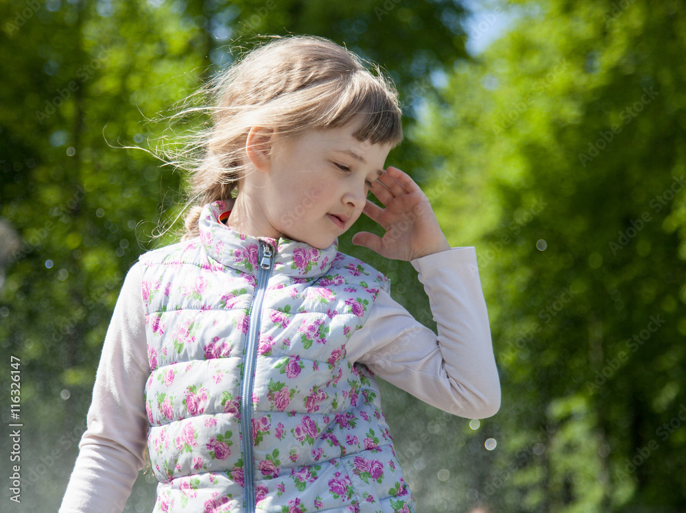 Portrait of a charming little girl in the park Portrait of a charming little girl in the park