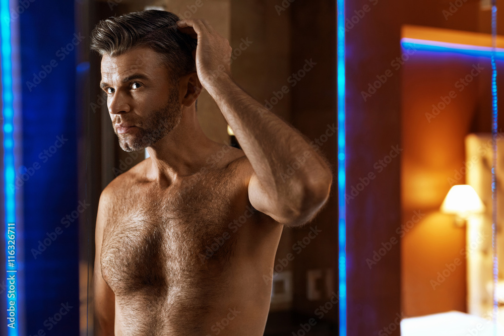 Men Hair Care. Handsome Man Touching His Hair. Men Grooming Men Hair Care. Handsome Man Touching His Hair. Men Grooming