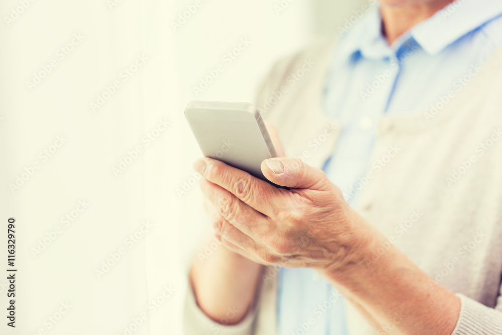 close up of senior woman with smartphone texting close up of senior woman with smartphone texting