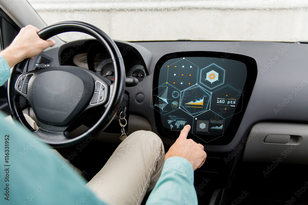 close up of man driving car with diagram on screen close up of man driving car with diagram on screen