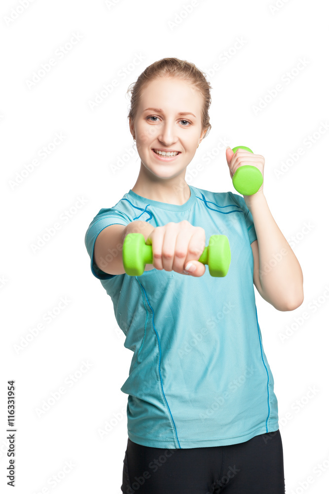 Athletic young woman works out with green dumbbells Athletic young woman works out with green dumbbells