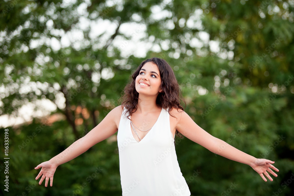 Beautiful brunette girl relaxing in the park Beautiful brunette girl relaxing in the park