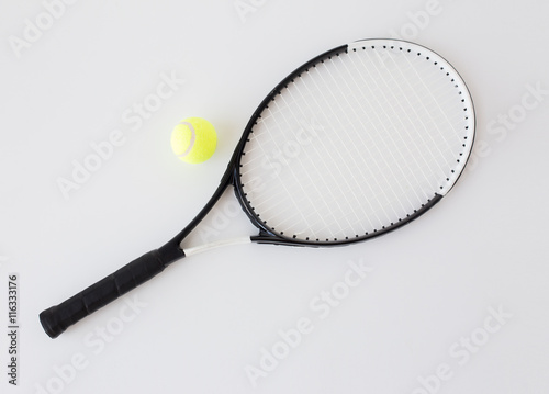 close up of tennis racket with ball