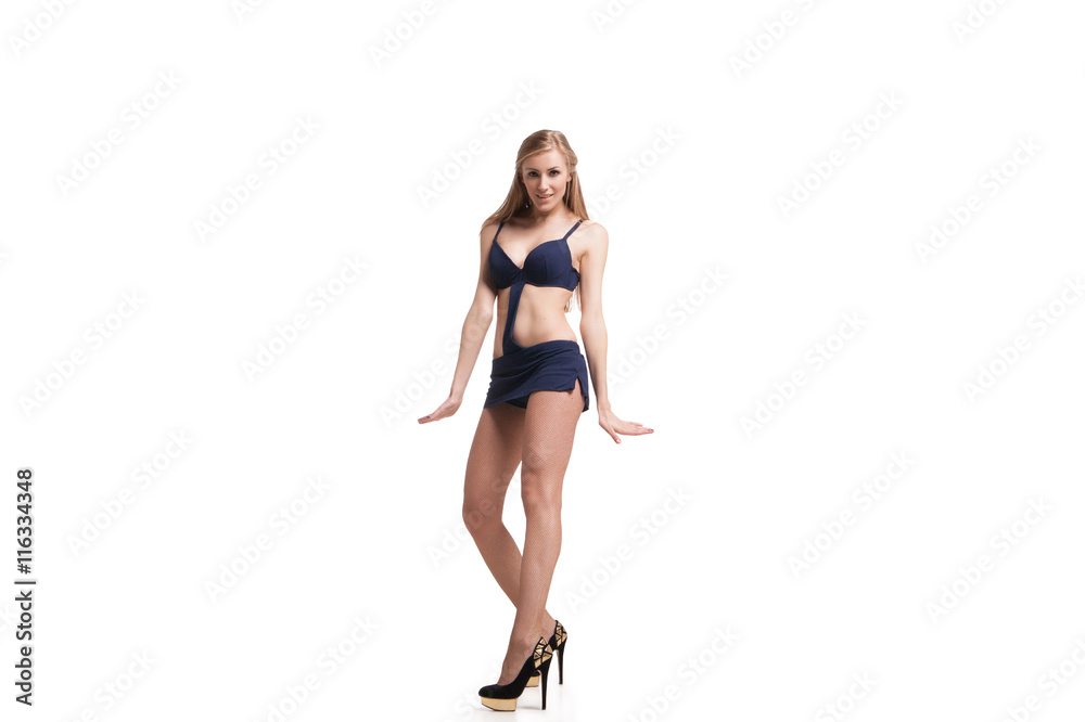 Young beautiful dancer posing on studio background Young beautiful dancer posing on studio background
