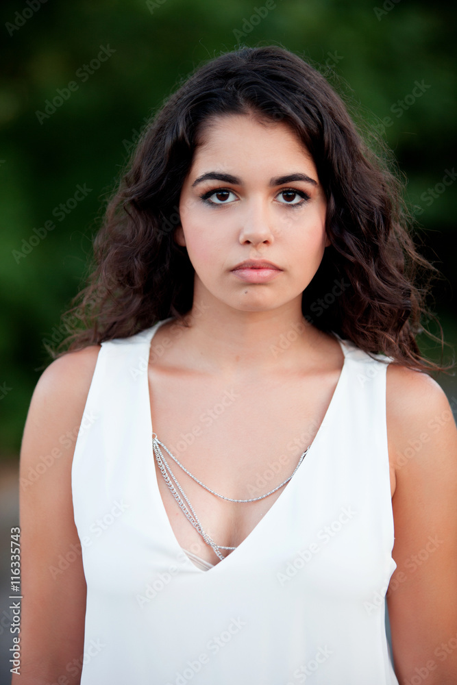 Beautiful brunette girl relaxing in the park Beautiful brunette girl relaxing in the park