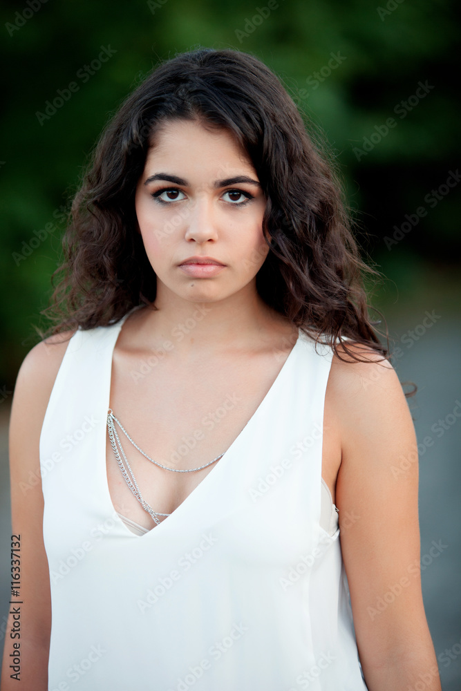 Beautiful brunette girl relaxing in the park Beautiful brunette girl relaxing in the park