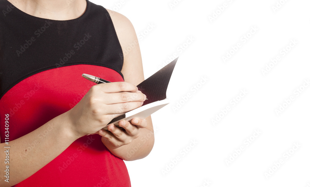 Woman hand writing her notebook Woman hand writing her notebook