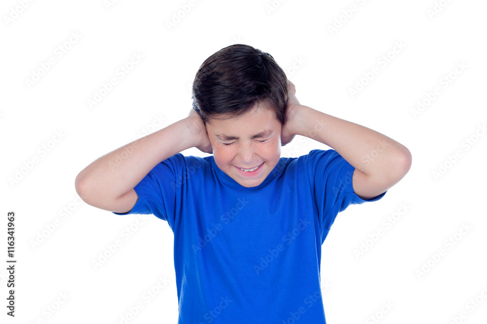 Stressed child covering his ears Stressed child covering his ears