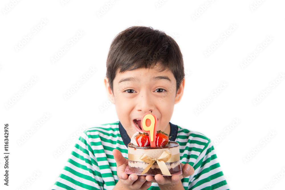 Little boy blowing candle on the cake for his birthday Little boy blowing candle on the cake for his birthday