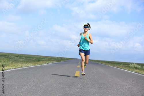 healthy lifestyle young fitness woman runner running on road